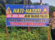 Rawan Dilintasi Kendaraan Berat, Jalur Berbahaya di Pelalawan Dipasangi Spanduk Peringatan